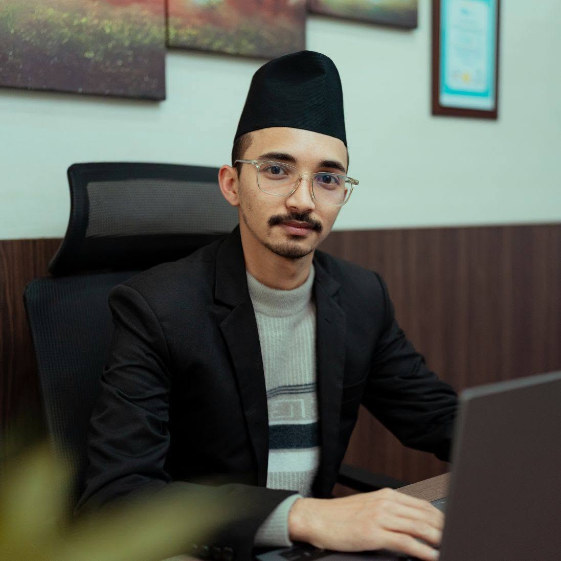 Aman Sharma sitting at a desk
